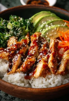 30-Minute Teriyaki Chicken Bowl garnished with vegetables and sauce.