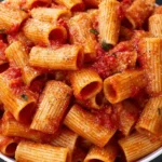Angry Rigatoni dish with spicy sauce and vibrant ingredients