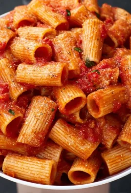 Angry Rigatoni dish with spicy sauce and vibrant ingredients