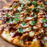 Delicious BBQ Chicken Pizza with smoky barbecue sauce and toppings.