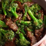 Delicious Beef and Broccoli stir-fry served on a plate with vegetables