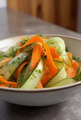 Colorful Carrot and Cucumber Ribbon Salad served in a bowl