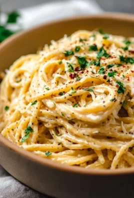 Cheesy garlic parmesan spaghetti topped with parsley
