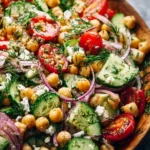 Fresh Chickpea Cucumber Salad served in a bowl with herbs and dressing