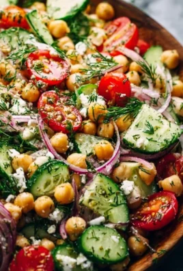 Fresh Chickpea Cucumber Salad served in a bowl with herbs and dressing