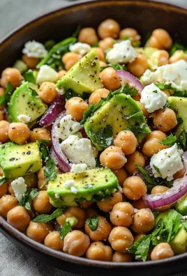 Chickpea Feta Avocado Salad in a bowl with colorful veggies