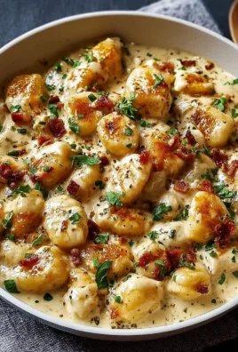 Creamy Crack Chicken Gnocchi in a bowl garnished with herbs