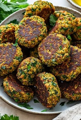 Plate of homemade easy falafel served with dipping sauce and salad