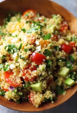 Delicious and colorful easy quinoa salad with fresh vegetables and dressing