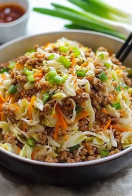 Healthy Egg Roll in a Bowl with fresh vegetables and savory sauce