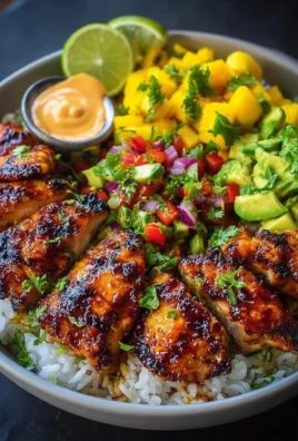 Grilled Maple Sriracha Chicken Bites served with coconut rice and mango avocado salsa
