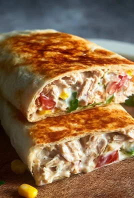Healthy tuna melt wrap with fresh ingredients and melted cheese