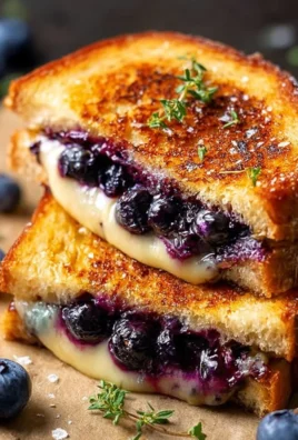 Delicious blueberry grilled cheese sandwich with melted cheese and fresh blueberries