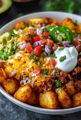 Delicious Loaded Potato Taco Bowl topped with fresh ingredients
