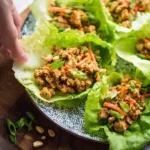 Low Carb Thai Chicken Lettuce Wraps served in fresh lettuce leaves
