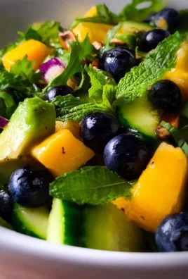Mango Cucumber Salad with Blueberry and Avocado served in a bowl