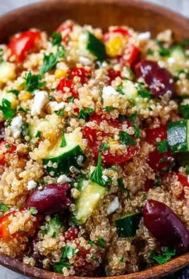 Colorful Mediterranean Quinoa Salad with fresh vegetables and herbs
