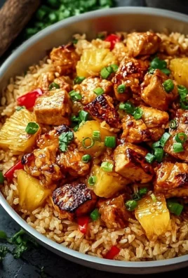 Pineapple chicken served with rice in a colorful plate