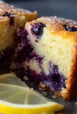 Soft and moist lemon blueberry yogurt cake topped with berries