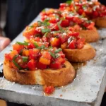 Delicious tomato bruschetta with fresh tomatoes and basil on toasted bread