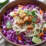 Colorful Asian noodle salad with vegetables and dressing
