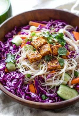 Colorful Asian noodle salad with vegetables and dressing