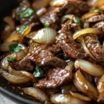 Delicious beef onion stir fry loaded with colorful vegetables