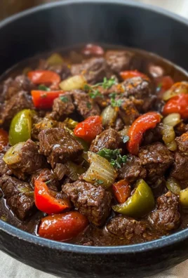 Plate of braised beef with Mediterranean spices garnished with herbs