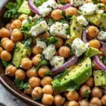 Chickpea Feta Avocado Salad with colorful vegetables and herbs