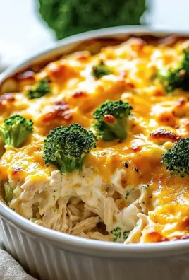 Creamy low carb chicken casserole topped with cheese and herbs in a baking dish