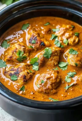 A delicious serving of homemade Crockpot Butter Chicken on a plate with rice.