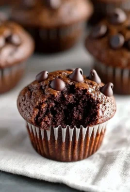 Delicious double chocolate chip muffins on a cooling rack