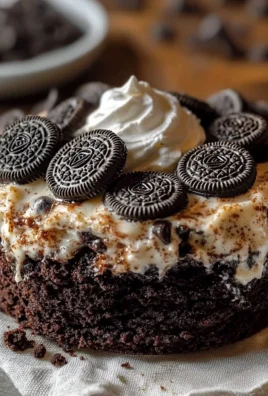 Easy Oreo Dump Cake topped with whipped cream and crushed Oreos