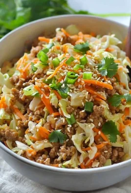 Egg roll in a bowl featuring vegetables and meat served in a bowl