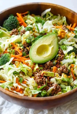 Colorful Egg Roll Salad In A Bowl with fresh vegetables and Asian-inspired flavors.