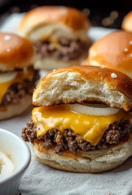 Delicious Hawaiian Roll cheeseburger sliders served on a platter.