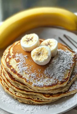 Fluffy high protein pancakes stacked with fresh berries and syrup
