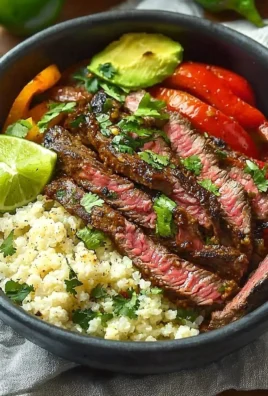 High protein steak fajita bowl with grilled steak and colorful vegetables
