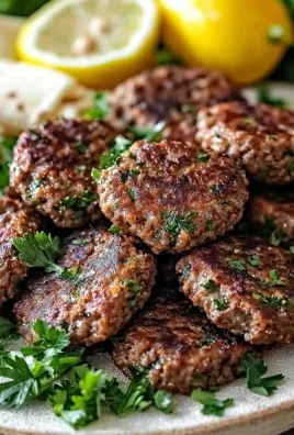 Delicious Lebanese Kafta patties with herbs and spices on a grill