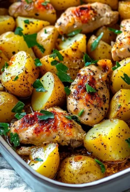 Lemon Garlic Chicken served with roasted potatoes on a plate