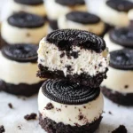 Oreo Cheesecake Bites served on a plate, garnished with chocolate and cookies.