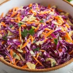 Fresh Red Cabbage Slaw served in a bowl with colorful vegetables