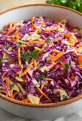 Fresh Red Cabbage Slaw served in a bowl with colorful vegetables