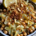 Shredded hispi cabbage salad topped with charred lemon slices