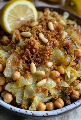 Shredded hispi cabbage salad topped with charred lemon slices