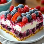 Delicious Summer Berry Jello Lasagna dessert with layers of berries and jello.