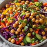 Thai-inspired chickpea salad with vegetables and herbs in a bowl