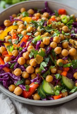 Thai-inspired chickpea salad with vegetables and herbs in a bowl