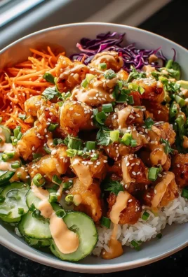 Delicious Bang Bang Chicken Bowl filled with vibrant vegetables and creamy sauce