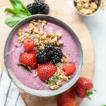 Colorful Berry Smoothie Bowl topped with fresh fruits and granola